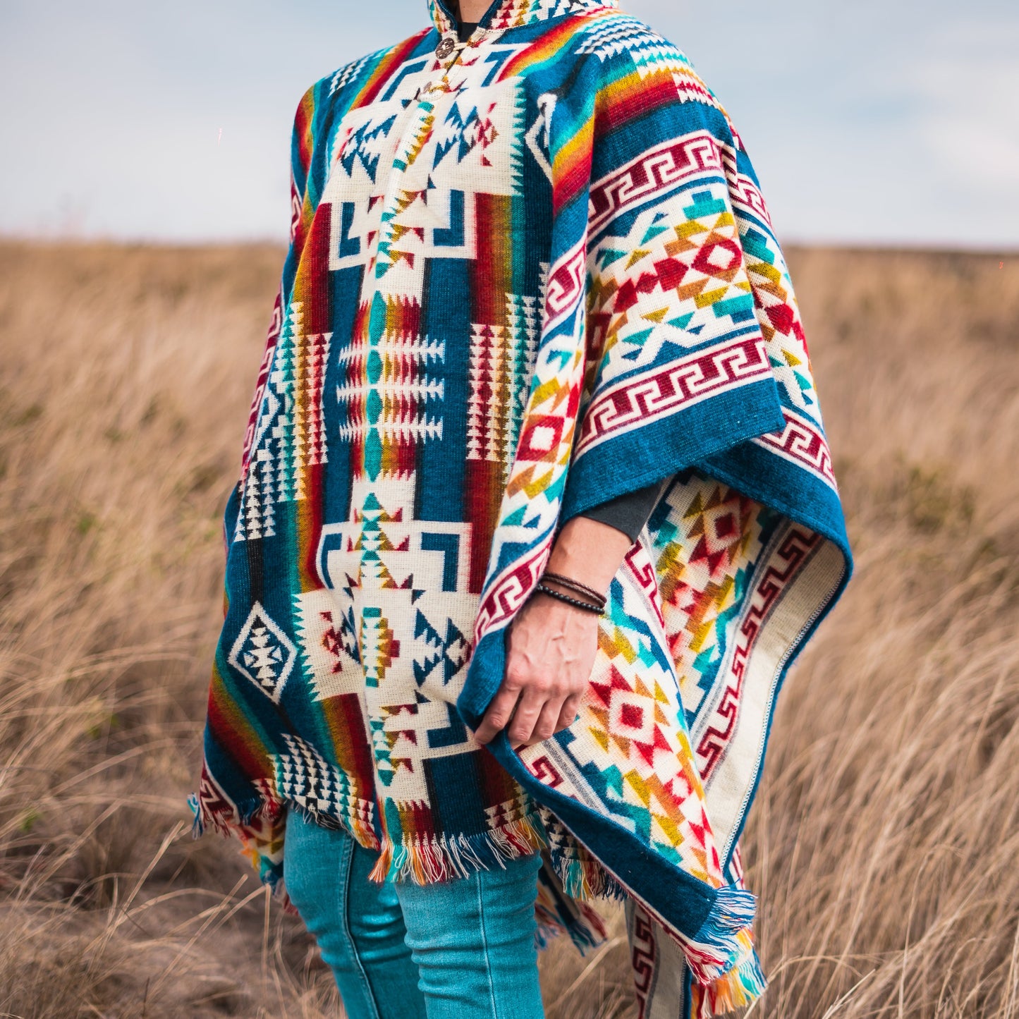 Men’s alpaca poncho handmade in the Andes with colorful geometric patterns, reversible design, warm and soft wool for outdoor and casual wear